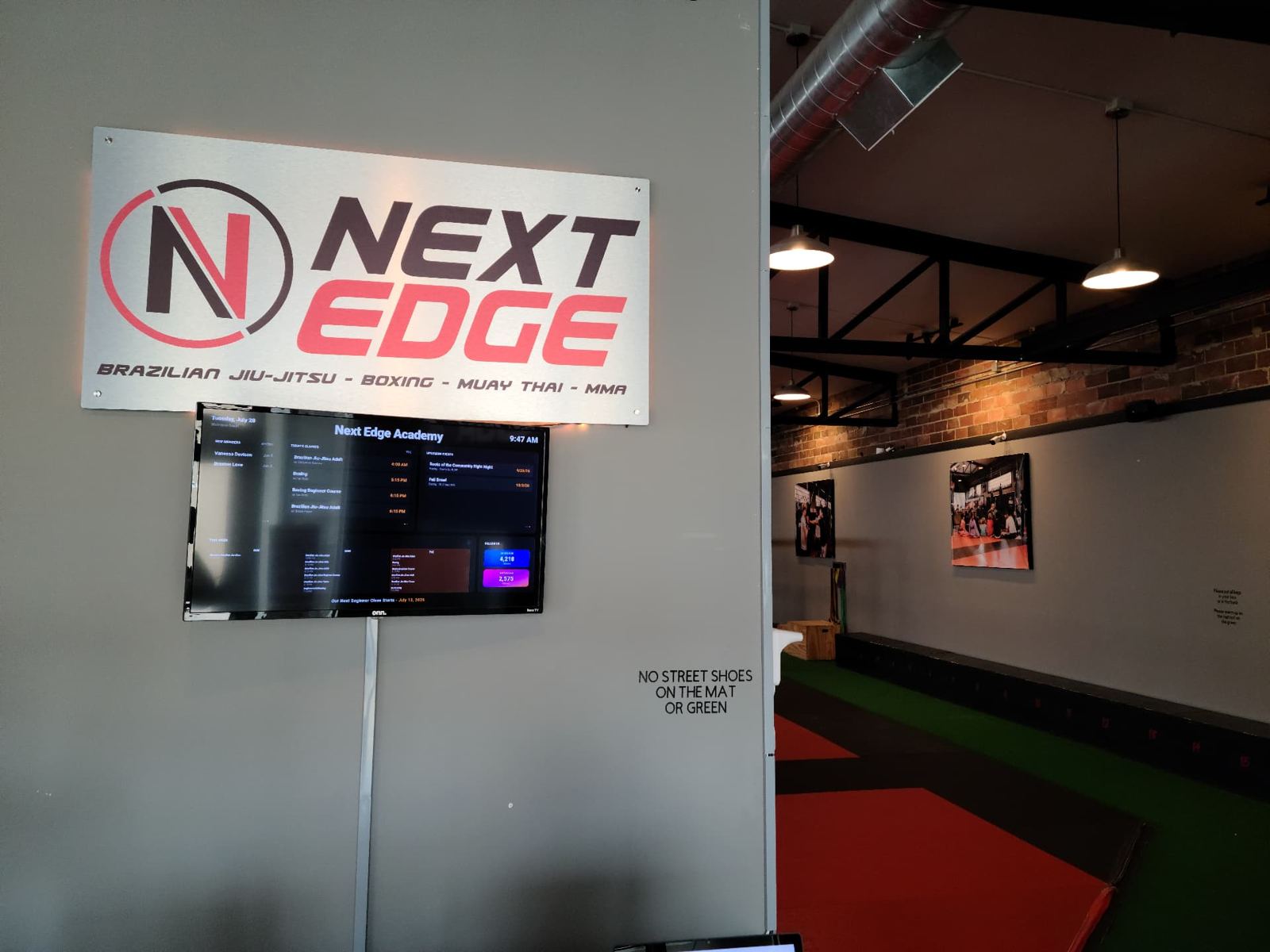 Next Edge Academy lobby and schedule board